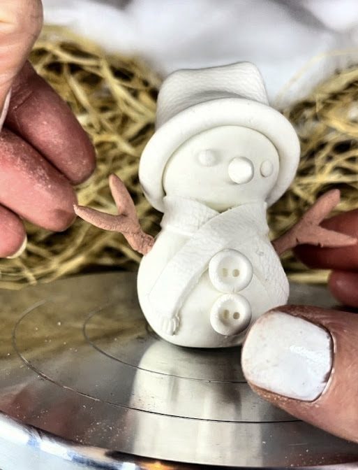 bras de bonhomme de neige en argile